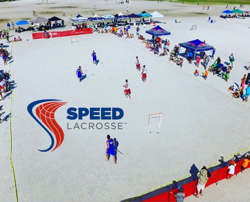 Image of pros playing speed lacrosse at the beach festival